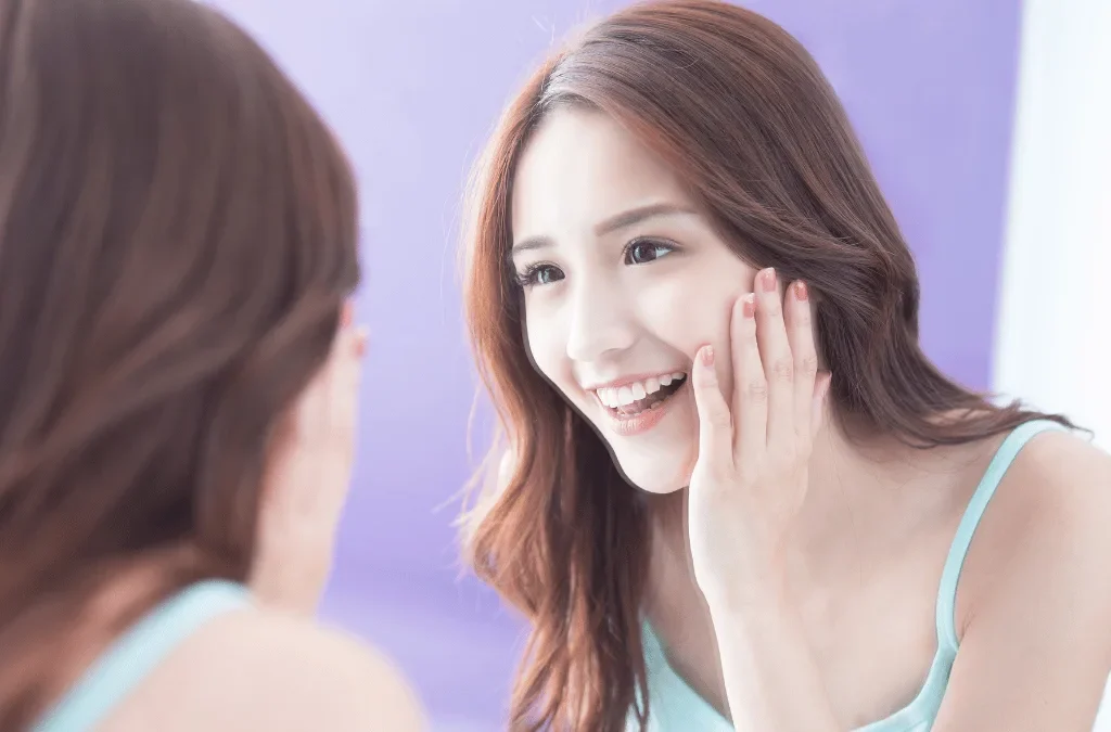 How to Be More Attractive: confident-woman-mirror-glow-up-transformation-tips